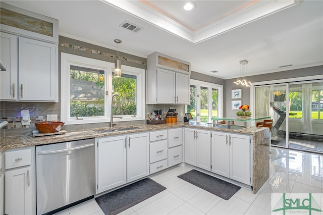 kitchen with a healthy amount of sunlight, dishwasher, and pendant lighting