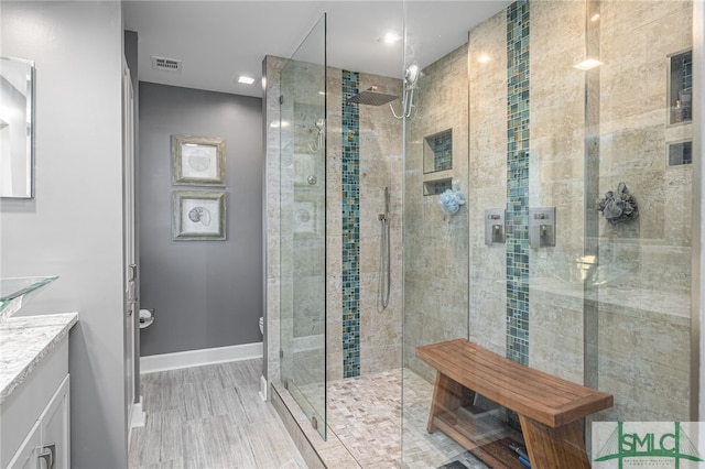 bathroom featuring vanity and walk in shower