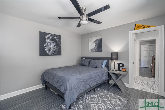 bedroom featuring ceiling fan and dark wood-type flooring