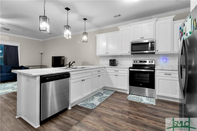 kitchen with kitchen peninsula, stainless steel appliances, white cabinets, and dark hardwood / wood-style floors