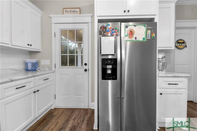 kitchen with white cabinets, stainless steel fridge with ice dispenser, dark hardwood / wood-style floors, and light stone countertops