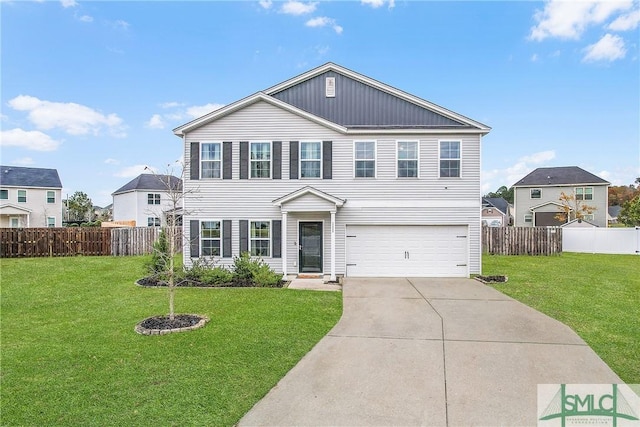 view of front facade with a front yard and a garage