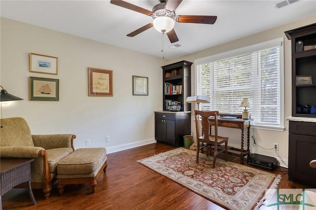 office area featuring ceiling fan and dark wood-type flooring