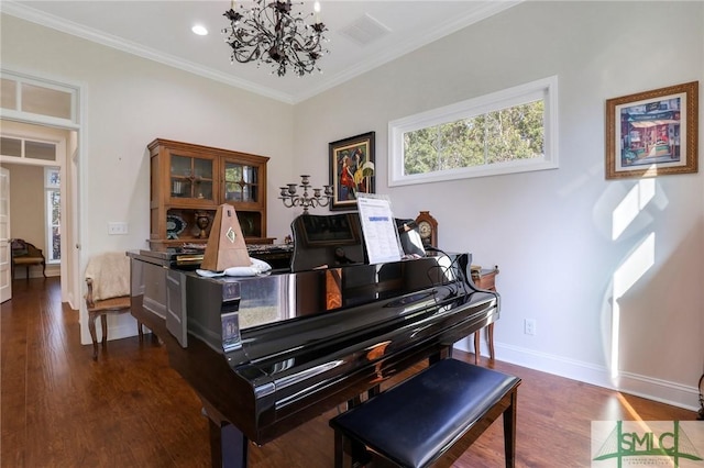 miscellaneous room with crown molding, dark wood-type flooring, and a notable chandelier