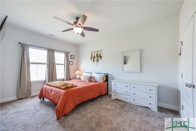 carpeted bedroom with ceiling fan