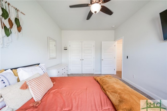 carpeted bedroom featuring a closet and ceiling fan