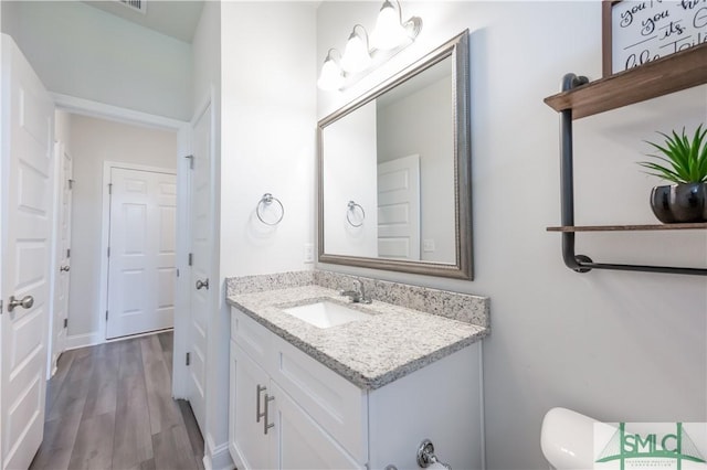 bathroom featuring hardwood / wood-style floors and vanity