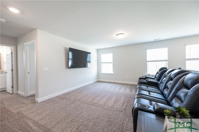 unfurnished living room featuring light carpet