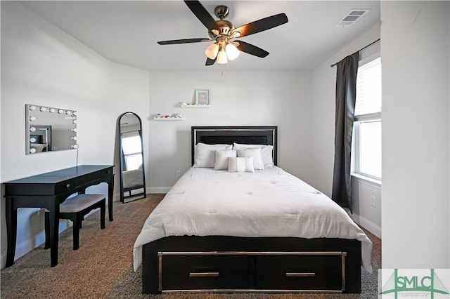 carpeted bedroom with ceiling fan