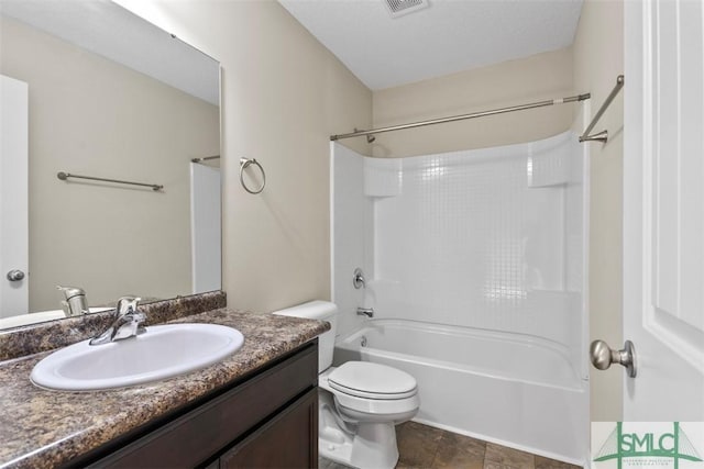 full bathroom with vanity,  shower combination, and toilet