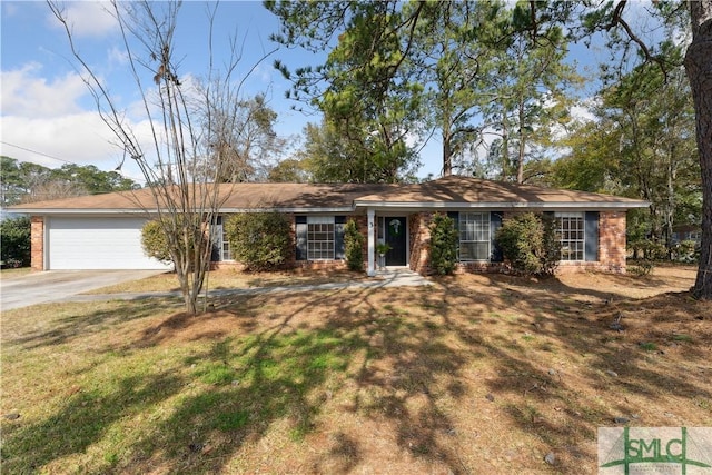 ranch-style home with a garage and a front lawn