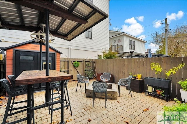 view of patio / terrace with a storage unit