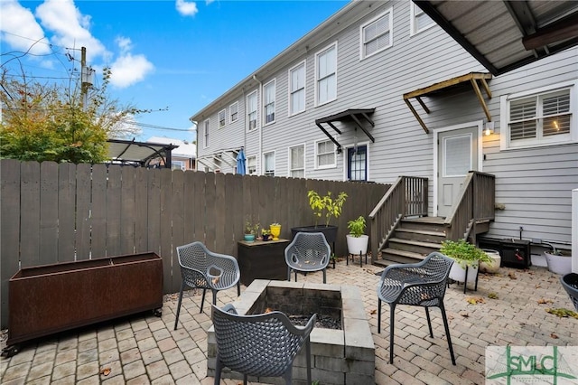 view of patio / terrace featuring an outdoor fire pit