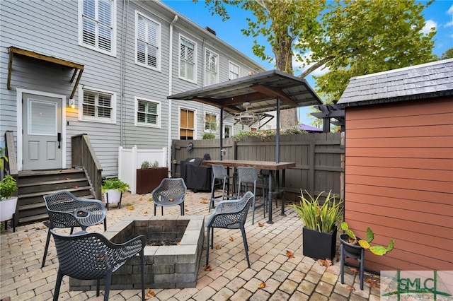 view of patio / terrace featuring grilling area and an outdoor fire pit