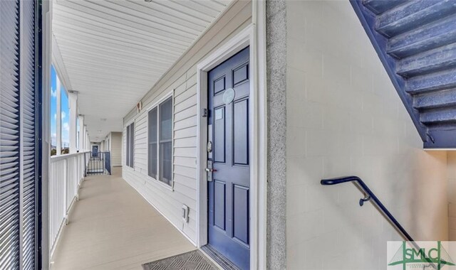 3 3rd St Unit 517, Tybee Island, GA 31328 - doorway to property with concrete block siding