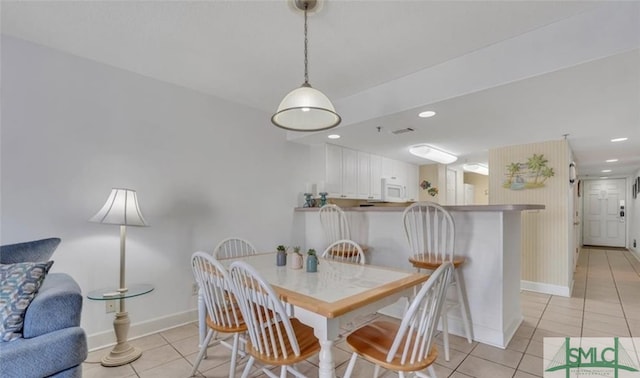 3 3rd St Unit 517, Tybee Island, GA 31328 - dining area featuring light tile patterned floors and recessed lighting