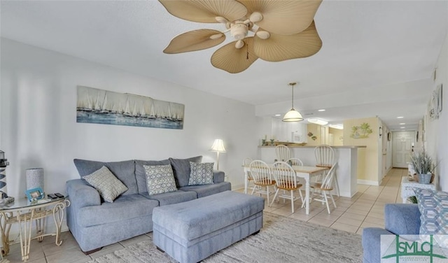 3 3rd St Unit 517, Tybee Island, GA 31328 - tiled living area featuring a ceiling fan and baseboards