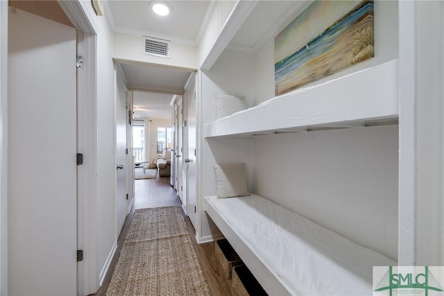 interior space featuring dark hardwood / wood-style flooring and ornamental molding