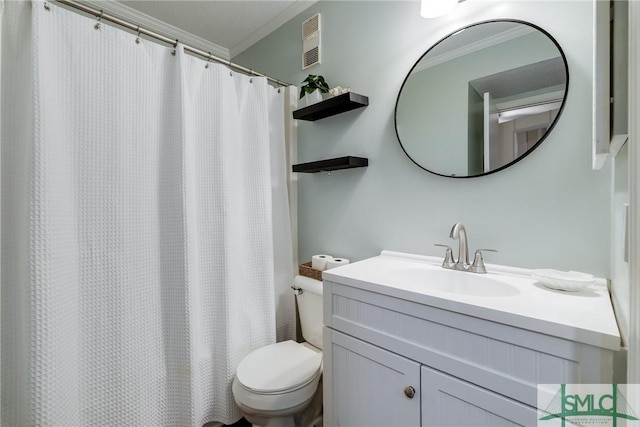 1217 Bay St Unit 105A, Tybee Island, GA 31328 - bathroom featuring crown molding, toilet, and vanity