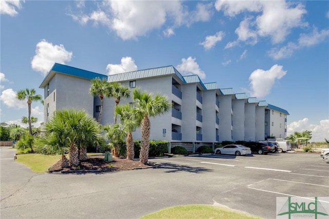 view of property with uncovered parking