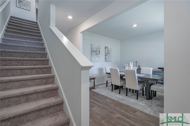 dining space featuring dark hardwood / wood-style floors