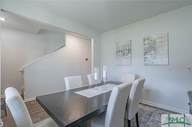 dining space featuring dark hardwood / wood-style floors