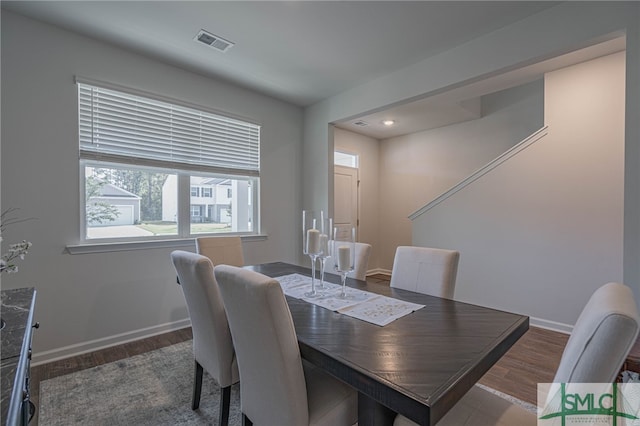 dining area with dark hardwood / wood-style floors