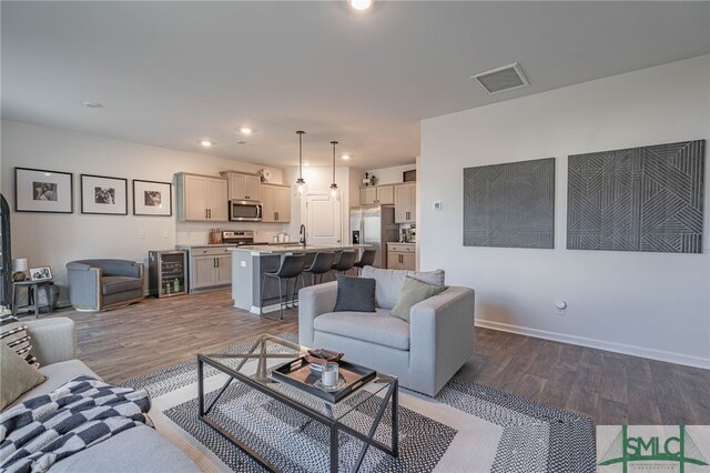 living room with wood-type flooring and wine cooler