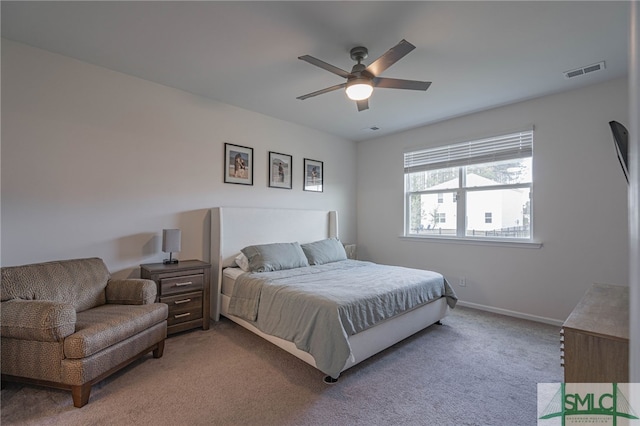 bedroom featuring light colored carpet and ceiling fan