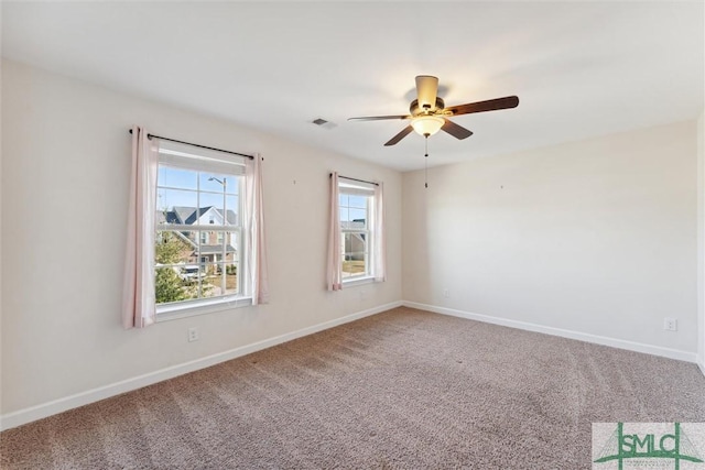 unfurnished room featuring visible vents, baseboards, ceiling fan, and carpet flooring