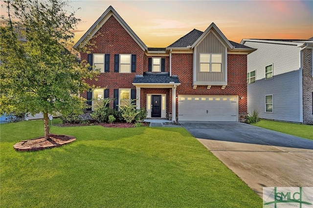 view of front of property with an attached garage, brick siding, concrete driveway, board and batten siding, and a front yard