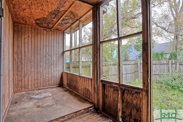 unfurnished sunroom with plenty of natural light