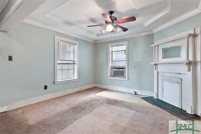 spare room with a textured ceiling, carpet floors, and crown molding