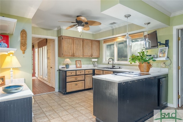 kitchen with ceiling fan, sink, kitchen peninsula, pendant lighting, and black electric stovetop