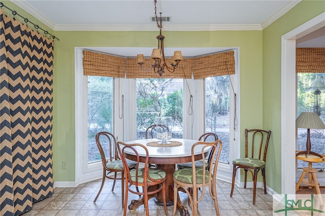 dining space featuring ornamental molding, a wealth of natural light, and a chandelier