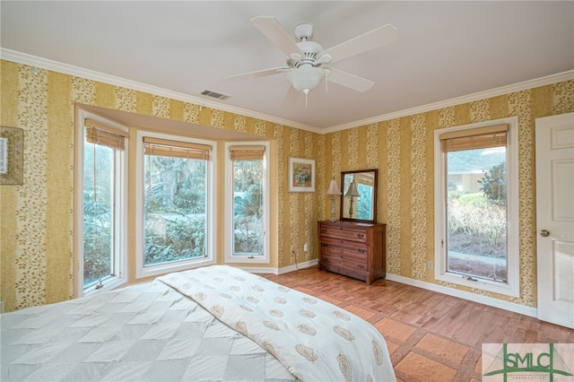 bedroom with ceiling fan, light hardwood / wood-style flooring, and ornamental molding