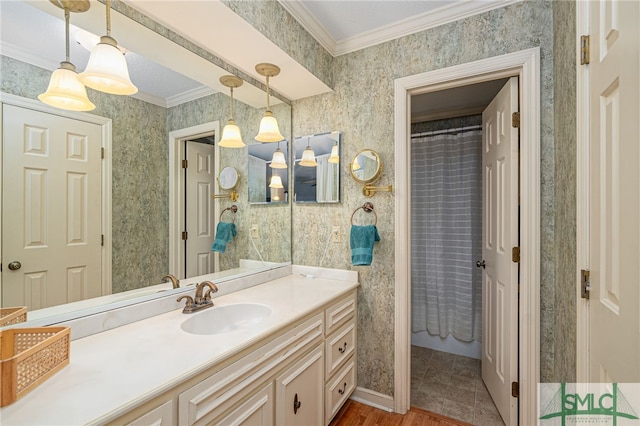 bathroom featuring tile patterned flooring, vanity, walk in shower, and crown molding