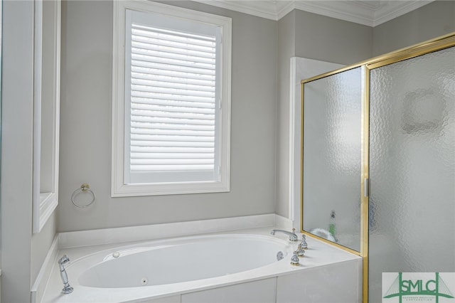 bathroom featuring ornamental molding and shower with separate bathtub