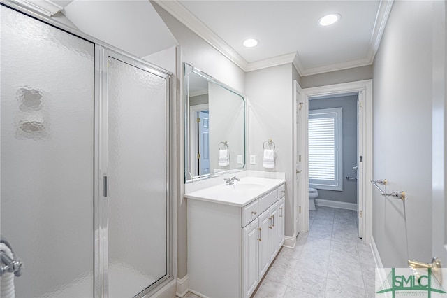 bathroom featuring tile patterned flooring, toilet, a shower with door, vanity, and ornamental molding