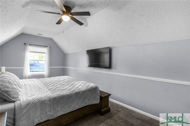 bedroom with vaulted ceiling, carpet, ceiling fan, and a textured ceiling