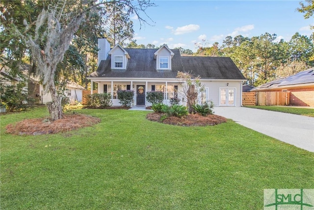 cape cod house featuring a front yard, french doors, and covered porch