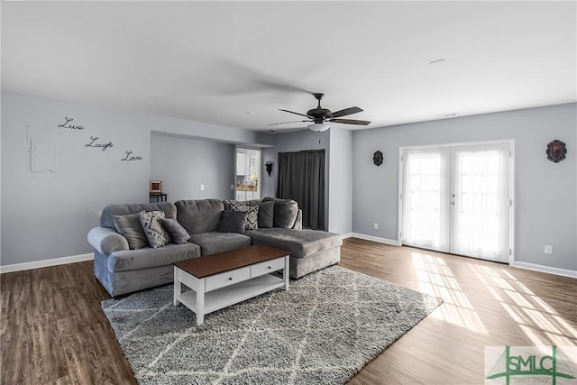 living room with french doors, ceiling fan, baseboards, and wood finished floors