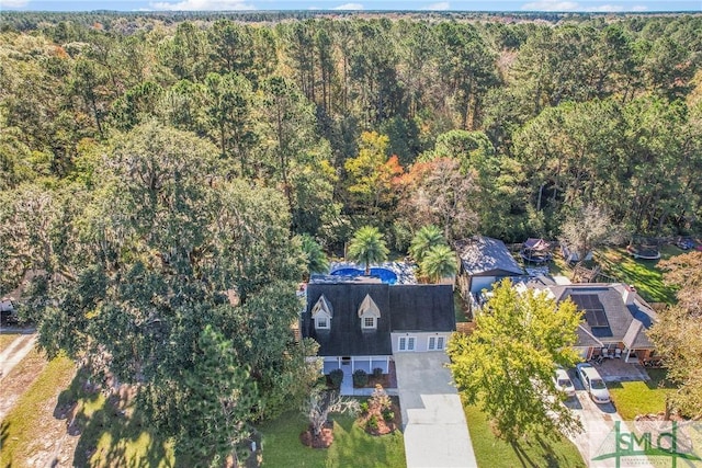 drone / aerial view with a view of trees