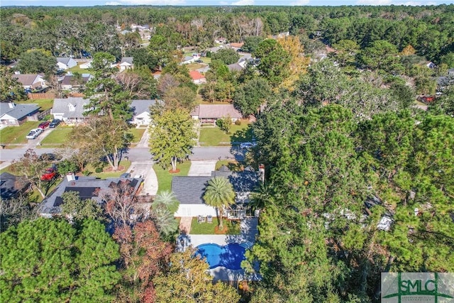 birds eye view of property with a wooded view and a residential view