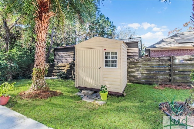 view of outbuilding with a lawn