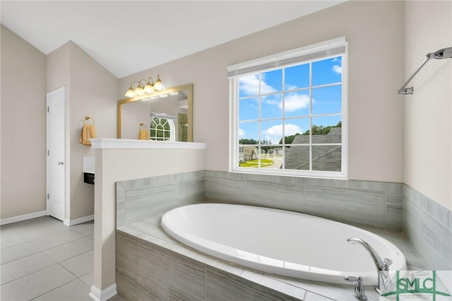 bathroom with tile patterned floors and tiled tub