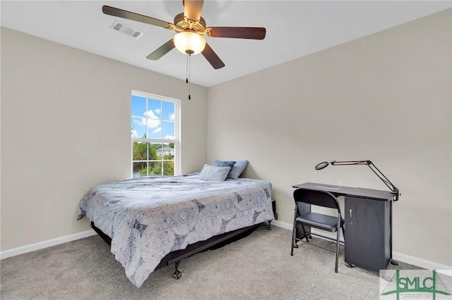 carpeted bedroom with ceiling fan