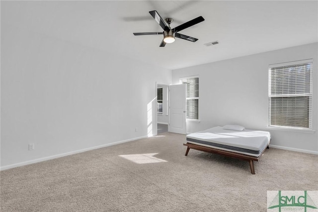 carpeted bedroom featuring ceiling fan