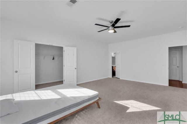 unfurnished bedroom with ceiling fan, a closet, and carpet