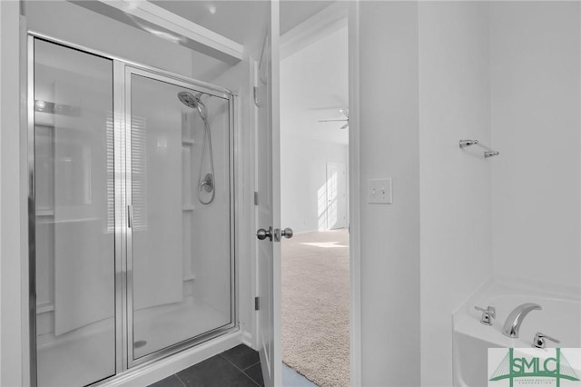 bathroom featuring tile patterned floors and walk in shower